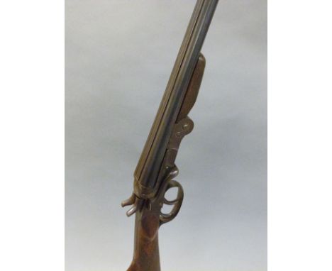 Belgian .410 side by side hammer action shotgun with chequered grip, double trigger, folding action, rebounding hammers and 2