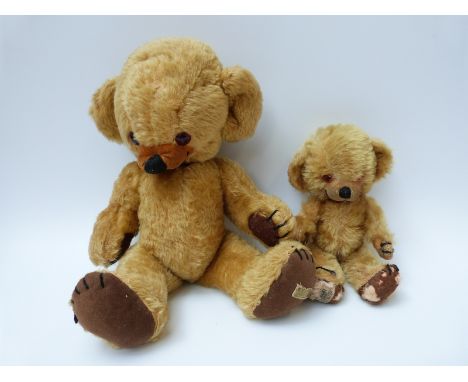 Two Merrythought Cheeky Teddy bears both with bells to ears, glass eyes mohair bodies, felt pads, large heads and original la