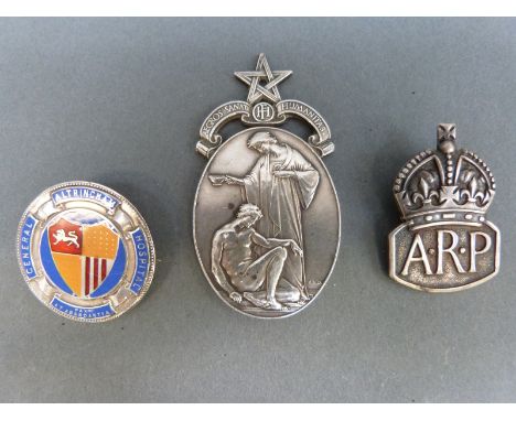 A hallmarked silver ARP badge, silver Masonic Hospital medallion and Altrichan Hospital silver and enamel badge