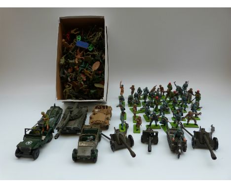 A large collection of Dinky Toys, Britains and similar diecast model vehicles and soldiers