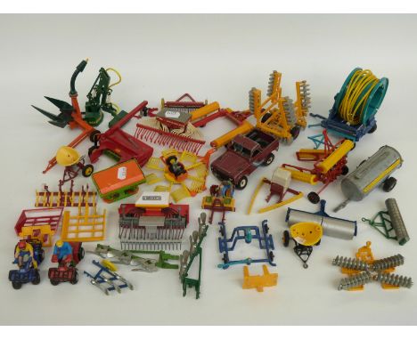 Thirty Britains and similar 1:32 scale diecast and plastic model farm vehicles and implements including quad bikes, mowers, s