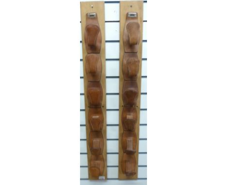 A pair of whip or stick display brackets made from hooves, another leather pair and a similar wooden rack
