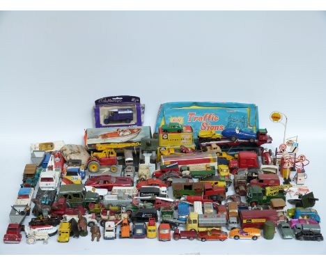A large collection of Corgi, Dinky, Matchbox and similar diecast model vehicles and accessories, some in original boxes