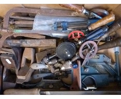 A quantity of woodworking tools to include planes, drills etc