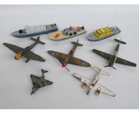 Eight Dinky Toys diecast model aeroplanes and boats, some military including Spitfire MKII, Submarine Chaser etc 