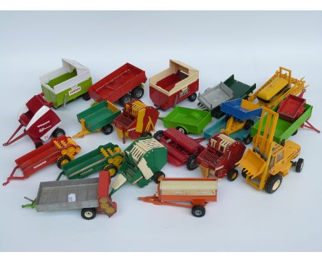 Twenty-two Britains and similar 1:32 scale diecast and plastic model agricultural vehicles including trailers, balers, spraye