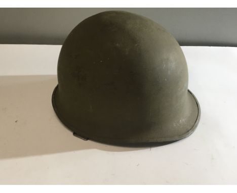 A US Army Vietnam helmet Combat helmet Mk 1 with date coinciding with the finial year of the Vietnam war 1975.
