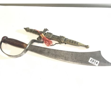 An Antique steel Indian Machete type steel knife with a wood grip and one other ornamental dagger (2)