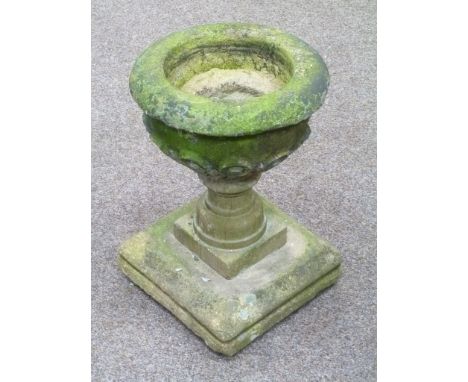 Small composite stone circular plant on plinth, H45cm