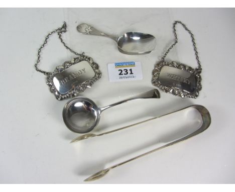 Silver caddy spoon, small ladle, pair sugar nips and brandy and whisky labels all hallmarked