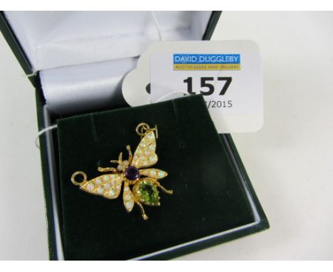 Gold plated butterfly brooch set with amethyst, peridot and opals
