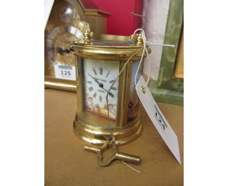 Small round brass carriage clock by Elliott & Son of London H8.5cm (excluding handle)