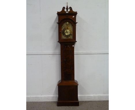 Granddaughter clock in richly figured case, brass dial with chiming movement the trunk forming a cupboard, H187cm