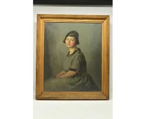 JOHN WHEATLEY (1892-1955) A SEATED PORTRAIT OF A FEMALE FIGURE, she is gazing straight at the viewer and wears a grey dress w