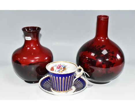 TWO ROYAL DOULTON FLAMBÉ VASES AND A MID NINETEENTH CENTURY TEACUP AND SAUCER, comprising a flambe Woodcut vase of bottle for