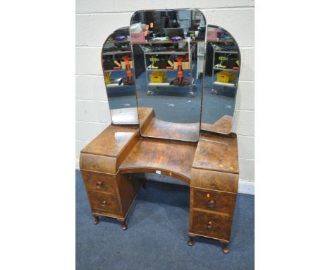 A BURR WALNUT ART DECO DRESSING TABLE, with triple mirror, six drawers, on cabriole legs, width 107cm x depth 54cm x height 1