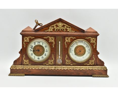 AN EARLY 20TH CENTURY OAK AND GILT METAL MOUNTED MANTEL CLOCK / BAROMETER OF ARCHITECTURAL FORM, the clock with enamel chapte