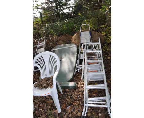 FIVE ALUMINIUM STEP LADDERS, two steel step ladder, a green plastic garden table and a white plastic chair (9)