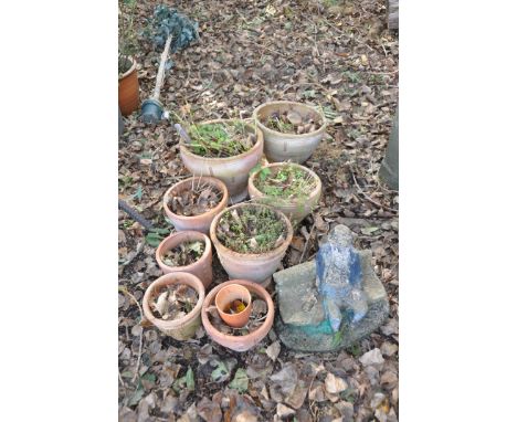 NINE MODERN TERRACOTTA PLANT POTS including a pair with brick patterning 39cm in diameter, 2 smaller matching, a garden figur