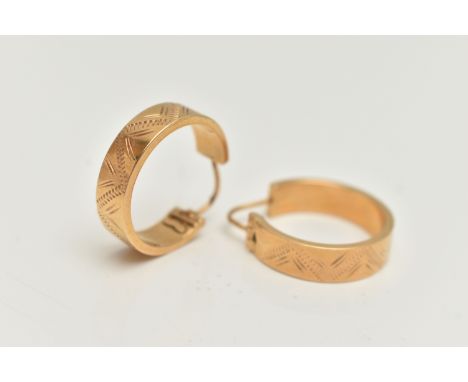 A PAIR OF YELLOW METAL HOOP EARRINGS, textured wide hoops, approximate width 5.1mm, stamped 750 Italian mark, lever fittings,