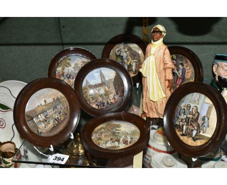 A ROYAL DOULTON 'IBRAHIM' FIGURE AND SEVEN FRAMED PRATTWARE POT LIDS, comprising Royal Doulton Ibrahim HN2095 figure, height 
