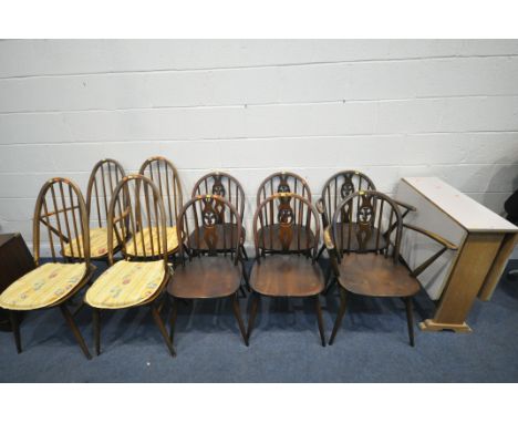 A FORMICA TOP DROP LEAF DINING TABLE, a set of six Ercol prince of Wales chairs, including two carvers, and a set of four Erc