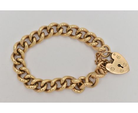 A HEAVY 9CT GOLD BRACELET, solid curb links, hallmarked 9ct Sheffield, fitted with a large heart padlock clasp, hallmarked 9c