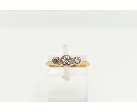 A YELLOW METAL THREE STONE DIAMOND RING, set with a three old cut diamonds, estimated total diamond weight 0.50cts, pinched s