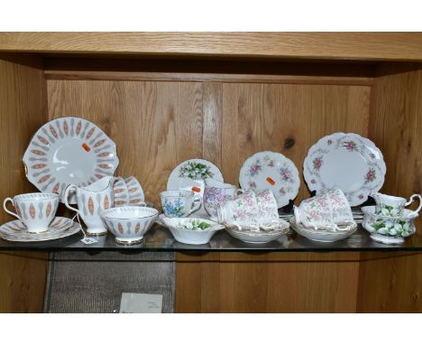 A GROUP OF ROYAL ALBERT TEAWARES, in various patterns comprising a twelve piece 'Safari' pattern tea set (one teacup with hai