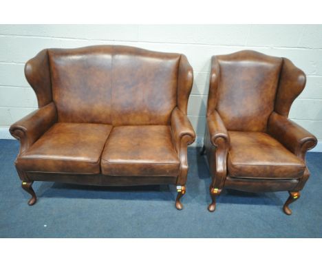 A SHERBOURNE BROWN LEATHER TWO PIECE LOUNGE SUITE, comprising a two seater wing back sofa, length 128cm x depth 84cm x height