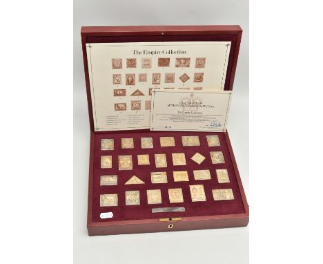 A CASED 'THE EMPIRE COLLECTION' GOLD PLATED SILVER STAMPS, set containing twenty-five stamps with certificate of authenticity