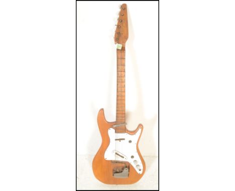 A mid 20th Century 1950's homemade six string electric guitar, having white scratch plate and oak neck, electrical components