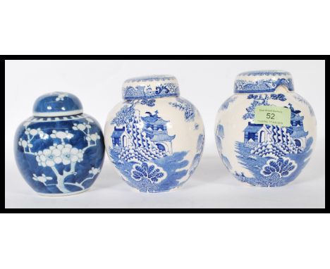 A pair of 20th Century Mason's tea caddy jars having the white ground with blue transfer printed willow pattern to the sides,