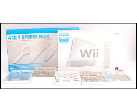 A boxed Nintendo Wii video games computer console complete with adaptor, 3-pin scart cable, remote, sensor along with an unof