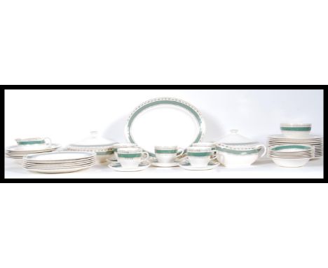 An extensive Crown Ducal dinner service in the 'Chatsworth' pattern containing dinner plates, side plates, bowls, lidded ture