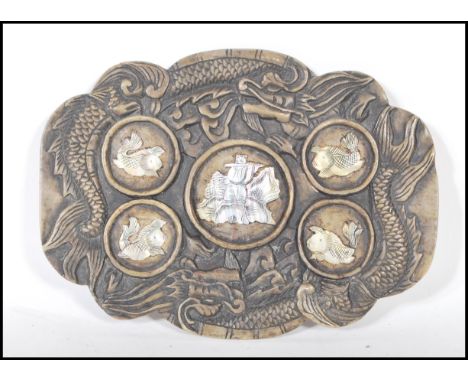 A 20th Century Chinese carved soapstone brush / ink palette having five circular panels with inlaid mother of pearl decoratio