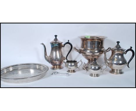 A mid 20th Century silver plated tea service consisting of teapot, water pot, creamer, sugar bowl set on gallery tray togethe