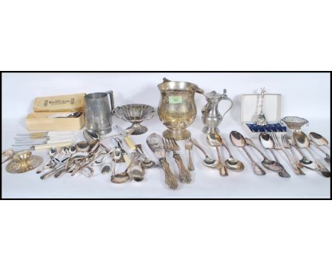 A collection of silver plate and pewter cutlery and table wear to include a good selection of mixed flatware, a glass bottome