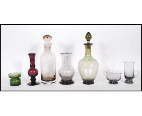 A collection of 20th Century glasswares to include an amethyst glass spill vase of knopped form, a Wedgwood smokey glass vase