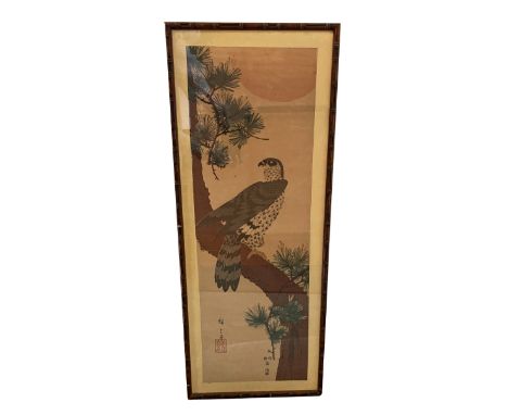 JAPANESE SCHOOL A bird of prey perched on the trunk of a knarled pine tree, signed, coloured wood block print, 71cm x 24cm; a