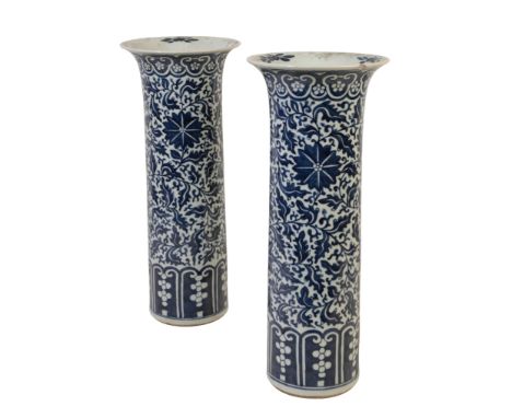 A PAIR OF CHINESE BLUE AND WHITE "SLEEVE" VASES in the Kangxi style, with flared rims and cylindrical bodies decorated with b