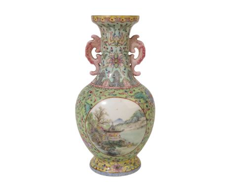 A CHINESE PORCELAIN VASE, finely enamelled with two circular medallions, one depicting figures in a lakeside pavilion with bl