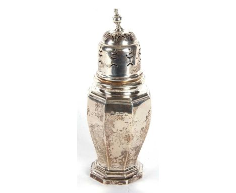 An Art Deco silver caster of plain octagonal form with pull off pierced lid having an urn shaped finial, hallmarked Birmingha