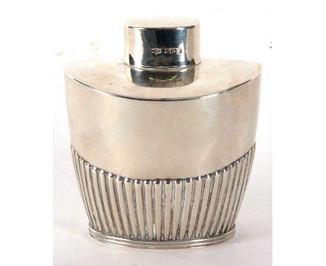 An Edwardian silver caddy of tapering oval form, part fluted body with pull off lid, hallmarked for Sheffield 1902, makers ma