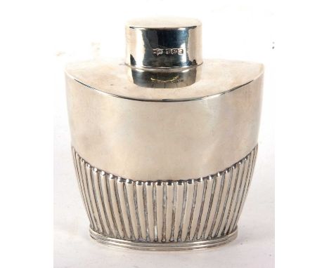 An Edwardian silver caddy of tapering oval form, part fluted body with pull off lid, hallmarked for Sheffield 1902, makers ma