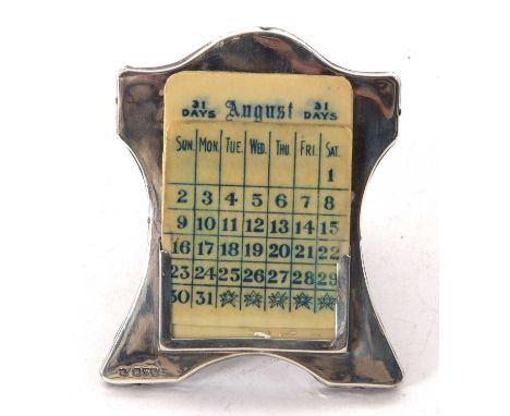 An Edwardian silver framed desk calendar, easel backed with celluloid cards (incomplete), hallmarked for Chester 1909, makers