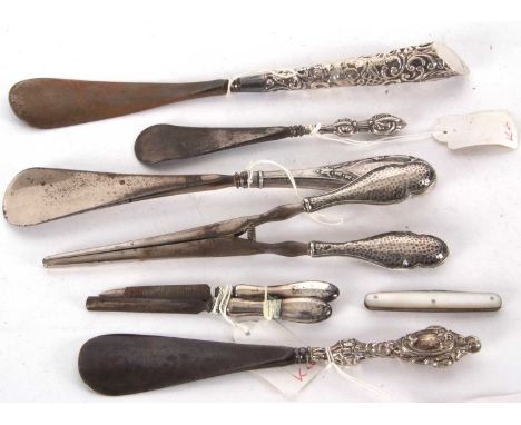 Mixed Lot: Four early 20th Century silver handled shoe horns, two silver handled pedicure tools together with a pair of Edwar
