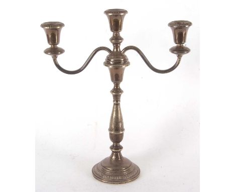 A modern sterling three light candelabra with gadrooned detail to sconces and base (loaded base), marked for Amston Sterling,