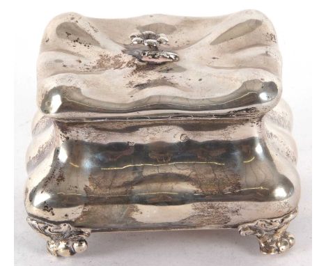 An antique Austrian silver caddy of plain bombe form and bombe shaped, the fluted lid with floral finial, applied key escutch