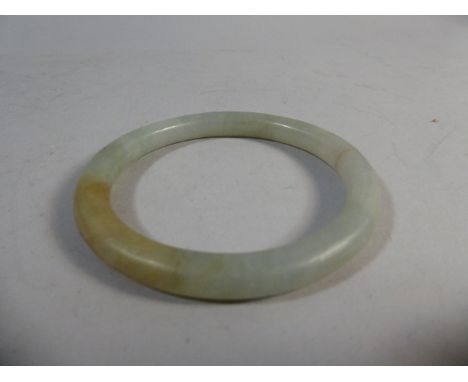 A Jade Bangle. 8cm Diameter
